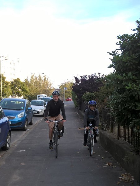 Bruce cycles with his son Bruce cycles with his son
