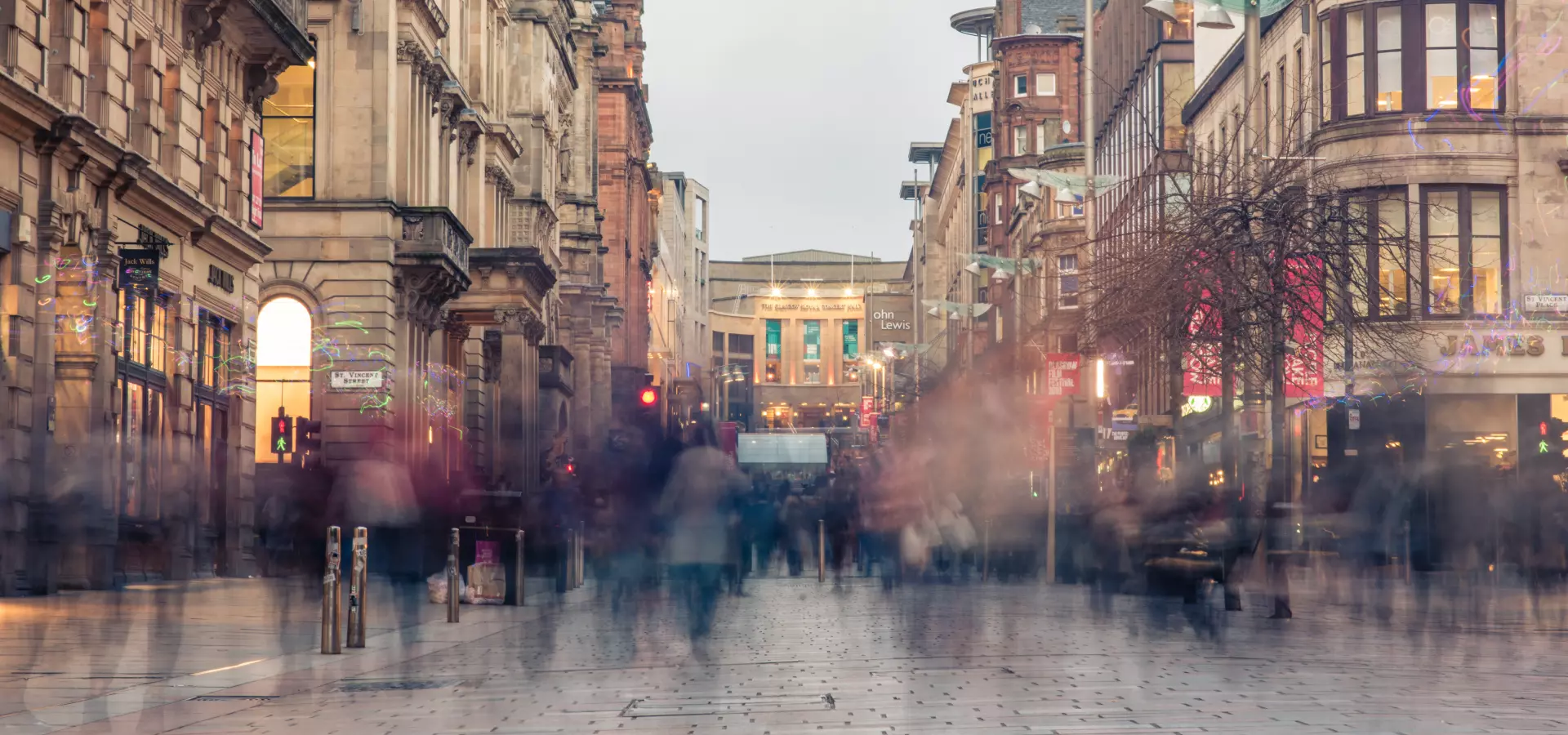 Street in Glasgow city centre with people walking.