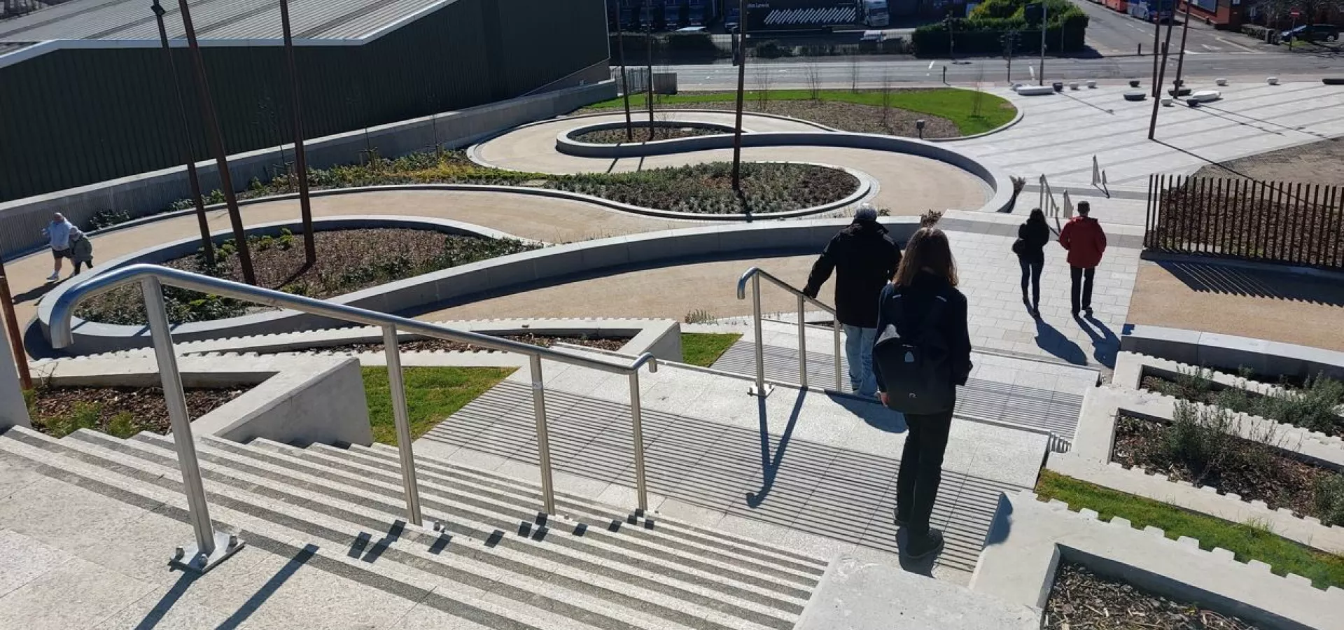 Pedestrians walking towards the Sighthill bridge.