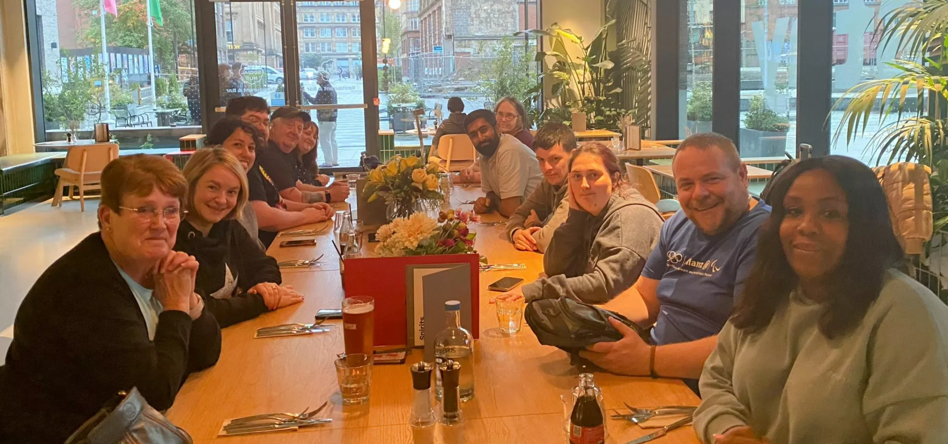 Lived Experience Panel members sitting around a table at a Glasgow restaurant